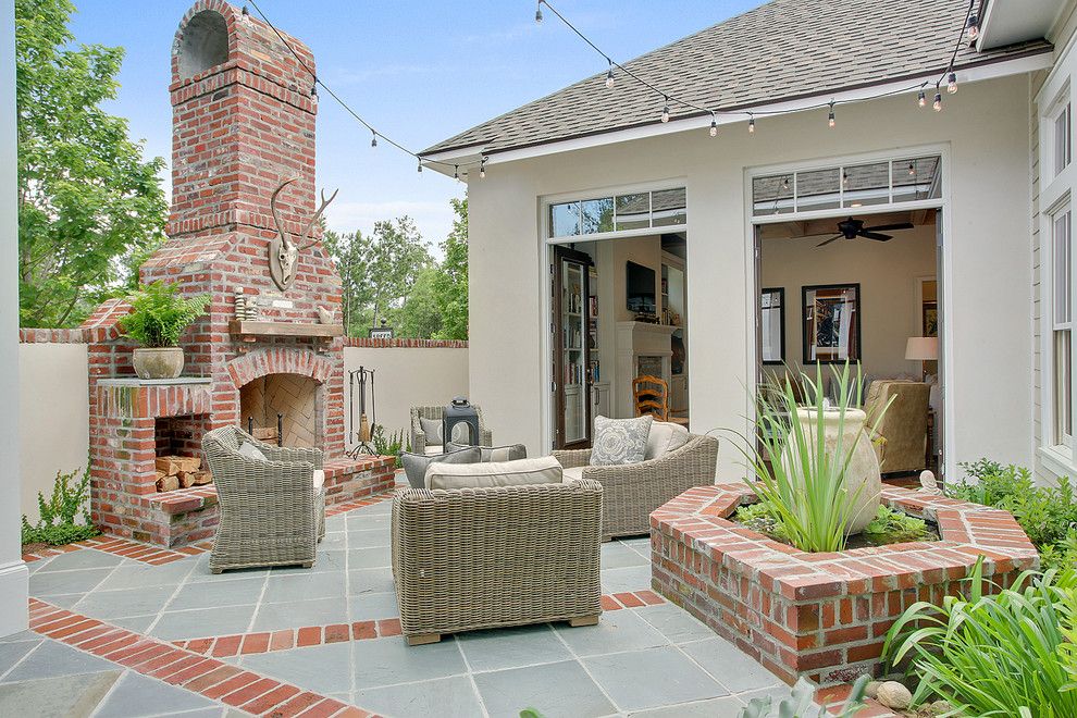 Levin Furniture Locations for a Traditional Patio with a Brick Fireplace and Private Courtyard by Highland Homes, Inc.