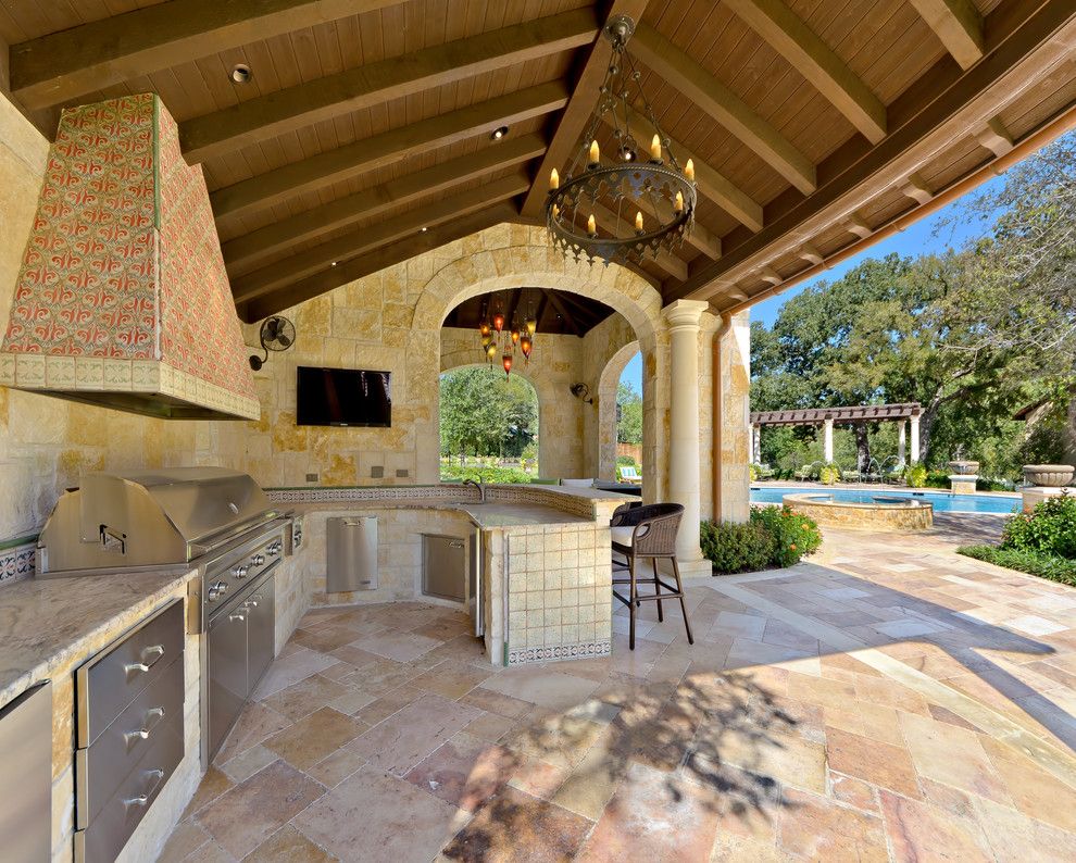 Limestone Grill for a Mediterranean Patio with a Covered and Private Residence   Mediterranean Style Estate by Harold Leidner Landscape Architects