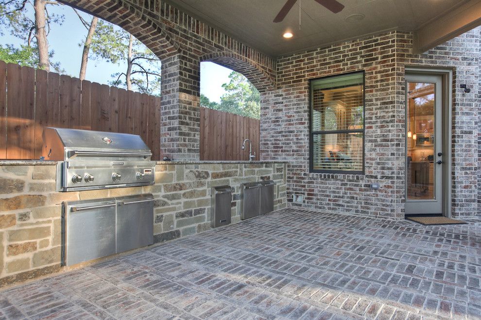 Limestone Grill for a Traditional Patio with a Ceiling Fan and Traditional Patio by Silvanhomes.com