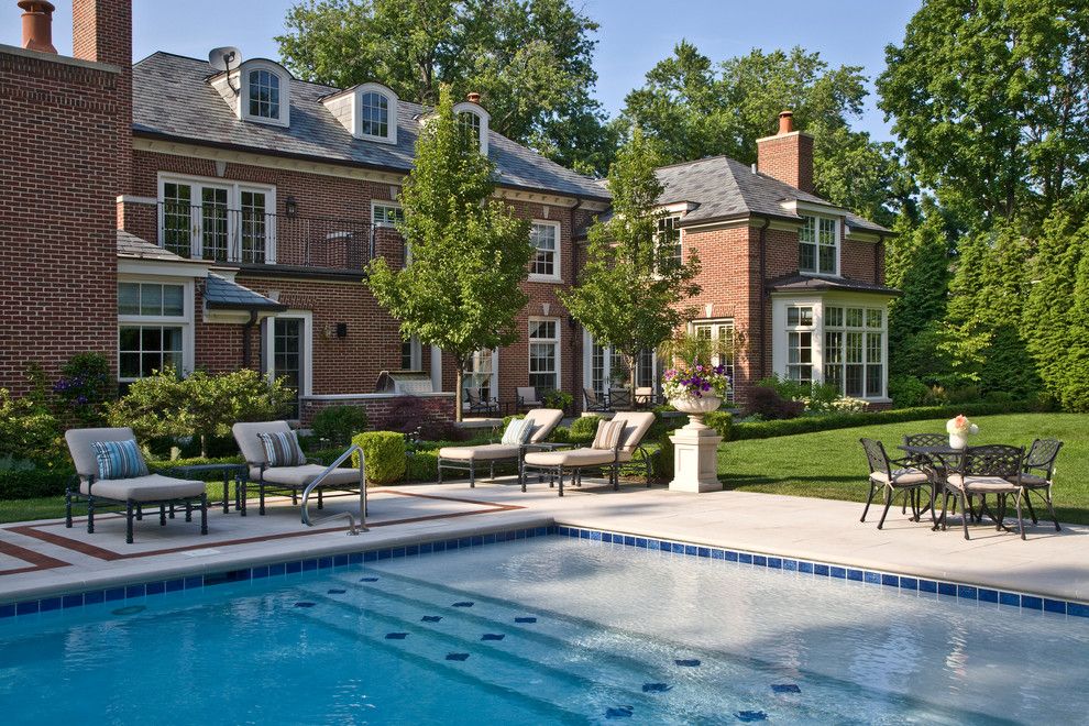 Limestone Grill for a Traditional Pool with a Lawn and the Carbonari Residence by Earth Developments, Inc.