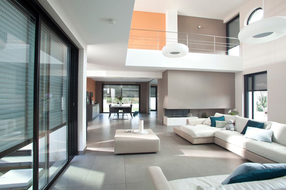 Lofting for a Modern Living Room with a Mezzanine and Somfy by Somfy Systems