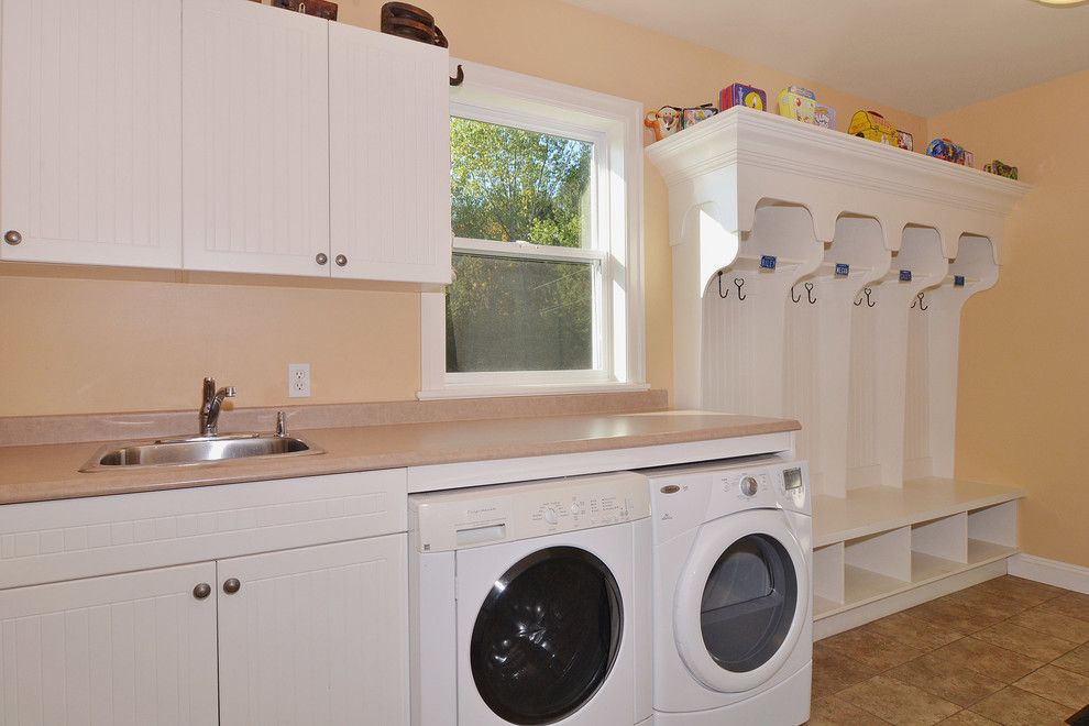 Louvered for a Craftsman Laundry Room with a Built in Storage and Fort Langley Home by F. M. Construction Ltd