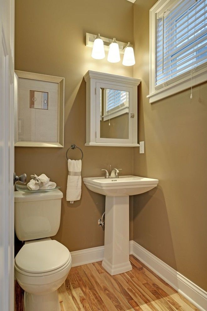 Lumber Liquidators Reviews for a Traditional Powder Room with a Traditional and Guest Bathroom by Sustainable Nine Design + Build