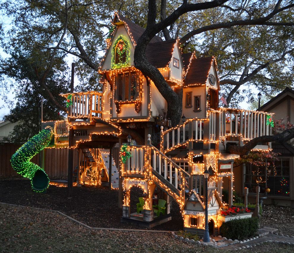 Magnolia Tree Care for a Eclectic Landscape with a Gable Roof and a Magical Tree House Lights Up for Christmas by Sarah Greenman