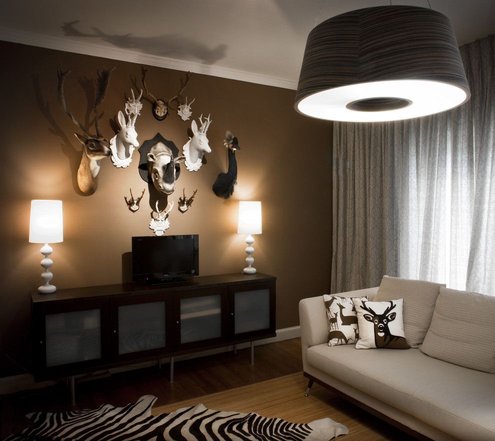 Mancaves for a Contemporary Family Room with a Brown Walls and Supon Phornirunlit/ Naked Decor by Supon Phornirunlit / Naked Decor