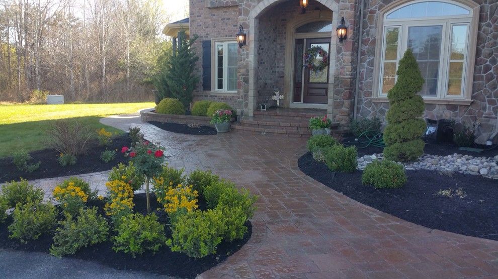 Marbeck Appliance for a Craftsman Patio with a Firepit and Front Walkway by Hansens Landscaping