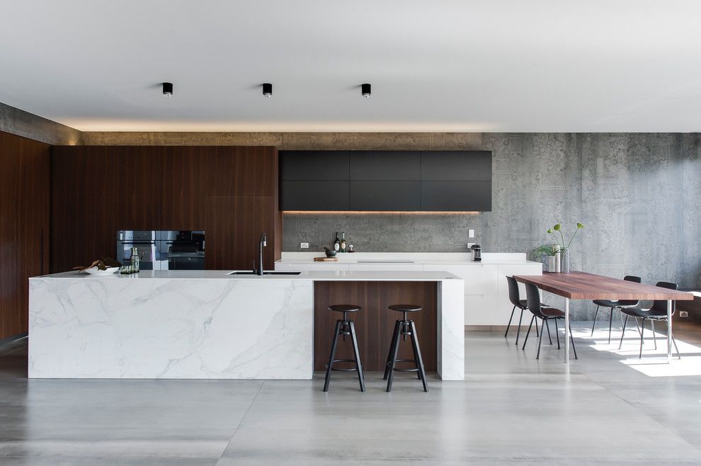 Marble Slab Locations for a Modern Kitchen with a Corian Kitchen and Crows Nest   Amazing Kitchen Design Leaves Us with House Envy by Minosa
