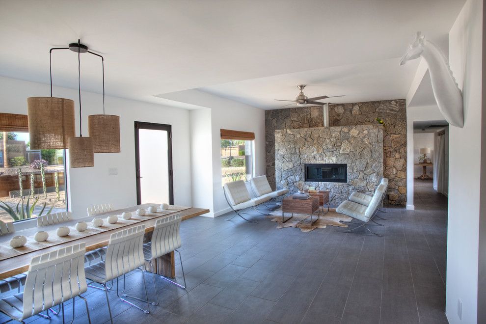 Masonry Veneer for a Southwestern Living Room with a Porcelain Floor and Black House (Steinman Renovation) by Spry Architecture