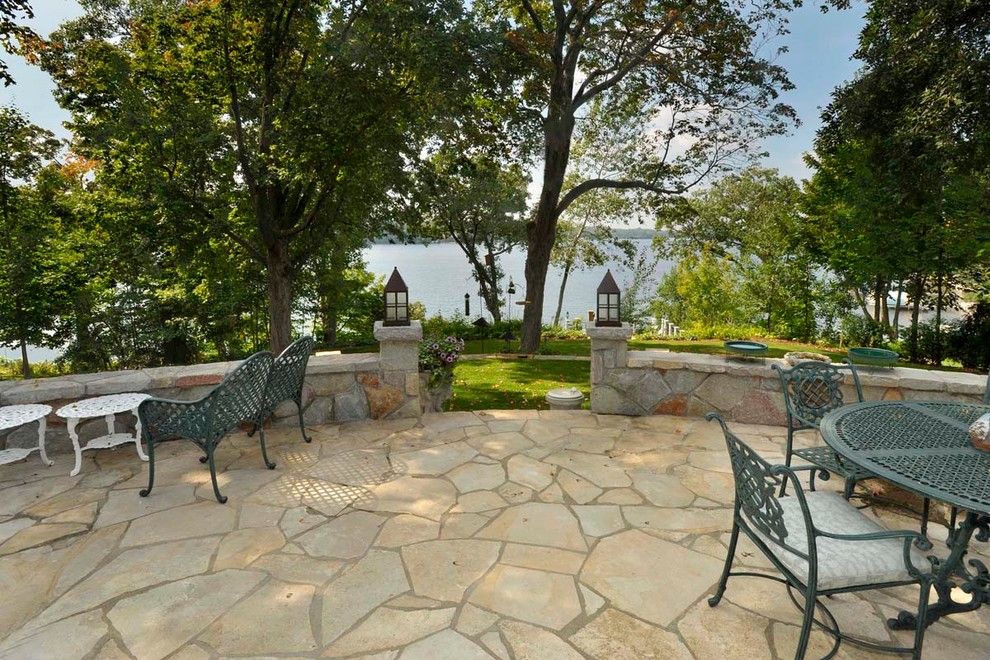 Masons Supply for a Traditional Landscape with a Stone Wall and 28. Lake Minnetonka Cottage by Sharratt Design & Company