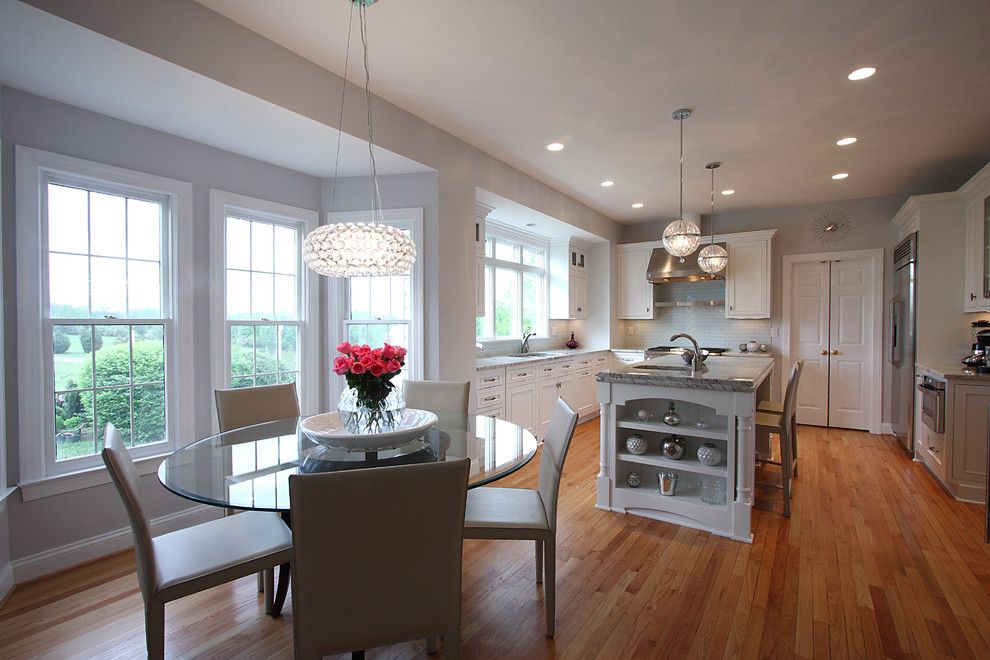 Mayer Electric Supply for a Traditional Kitchen with a Wood Floor and Contemporary Lighting + Classic Design by Nvs Remodeling & Design