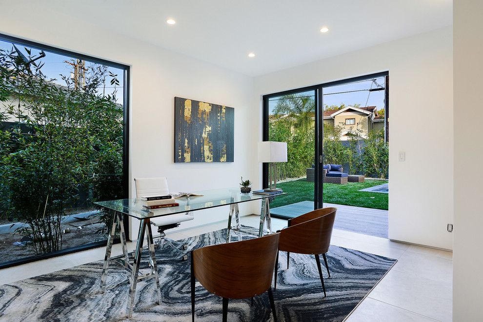 Mesko Glass for a Contemporary Home Office with a Books on Table and 4412 Motor by Hillstar Construction Services