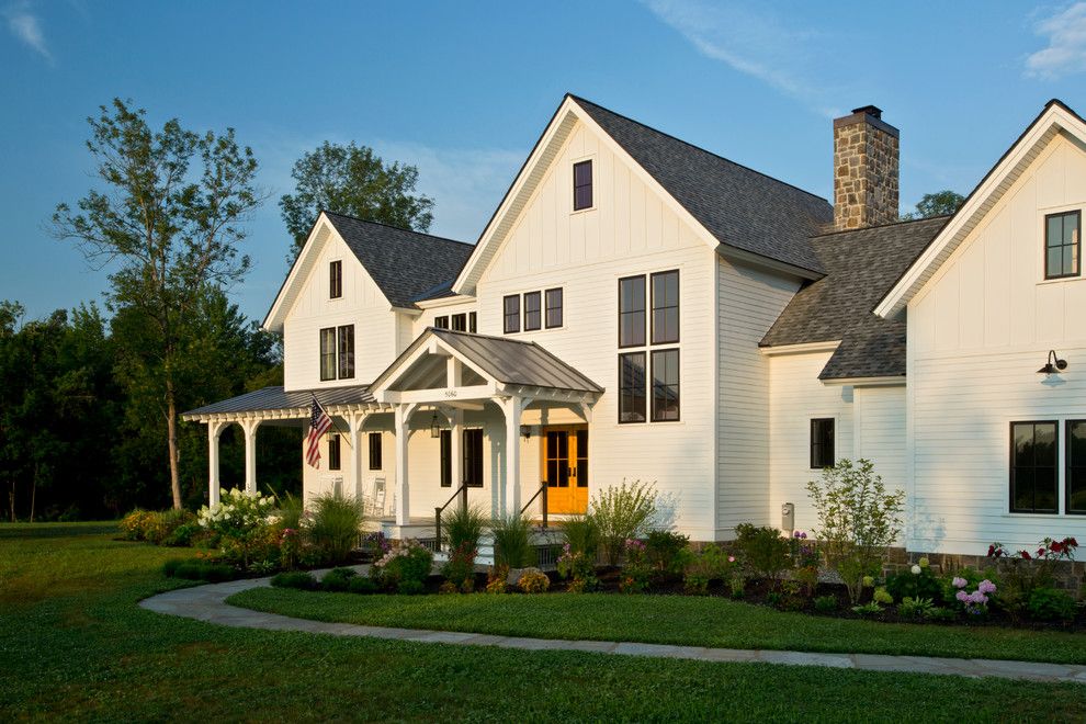 Metro Brokers Denver for a Farmhouse Exterior with a Portico and Farmhouse Vernacular by Teakwood Builders, Inc.