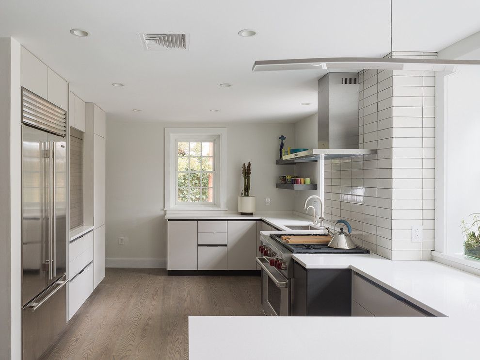 Michaels Flooring for a Contemporary Kitchen with a Range and Chestnut Hill Kitchen by C2 Architecture