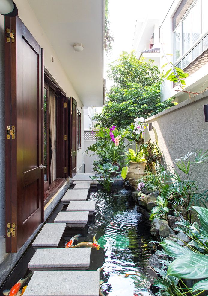 Monet's Garden for a Asian Landscape with a Folding Doors and Residence House in an Phu an Khanh ,District 2,Hcmc,Vietnam by Vietphu Design Construction Corporation