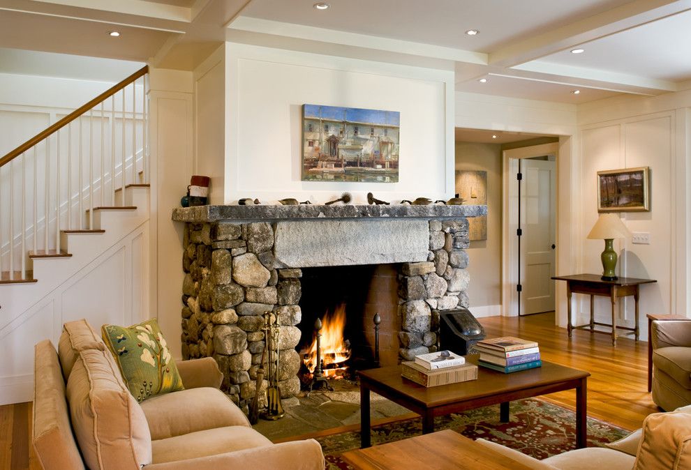 Monolithic Slab for a Farmhouse Living Room with a Coffered Ceiling and Living Room and Fireplace by Whitten Architects