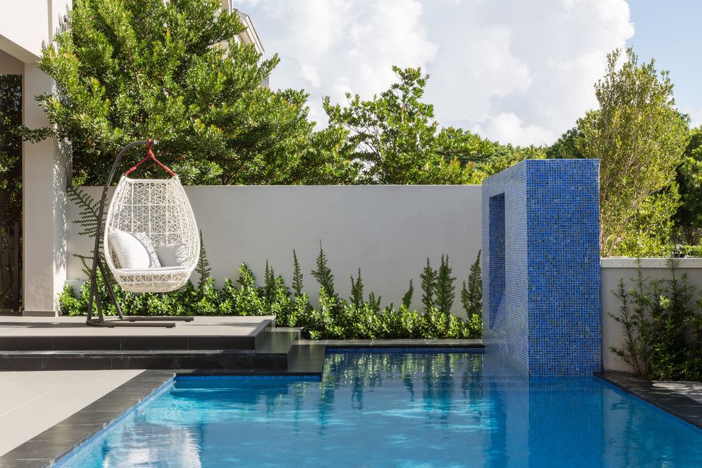 Mosart for a Contemporary Pool with a Egg Swing and South Miami Townhouse by Touzet Studio