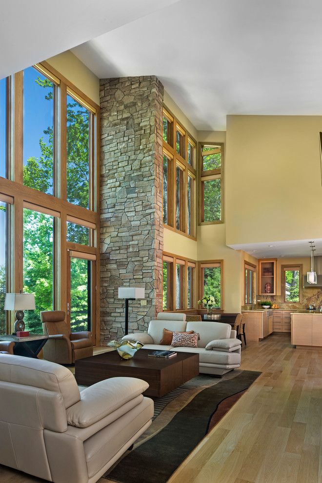 Mosey for a Transitional Living Room with a Two Story Window Wall and Modern Prairie Lake Home by Joseph Mosey Architecture, Inc.