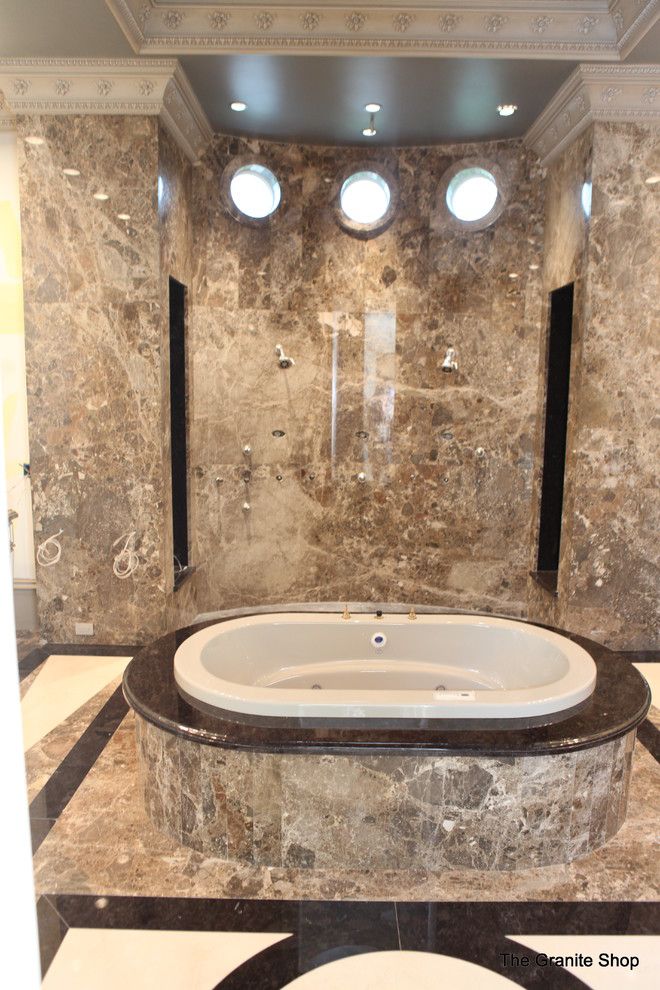 Munire for a Modern Bathroom with a Natural Stone and Modern Slab Bathroom Floor with Design & Slab Shower by the Granite Shop