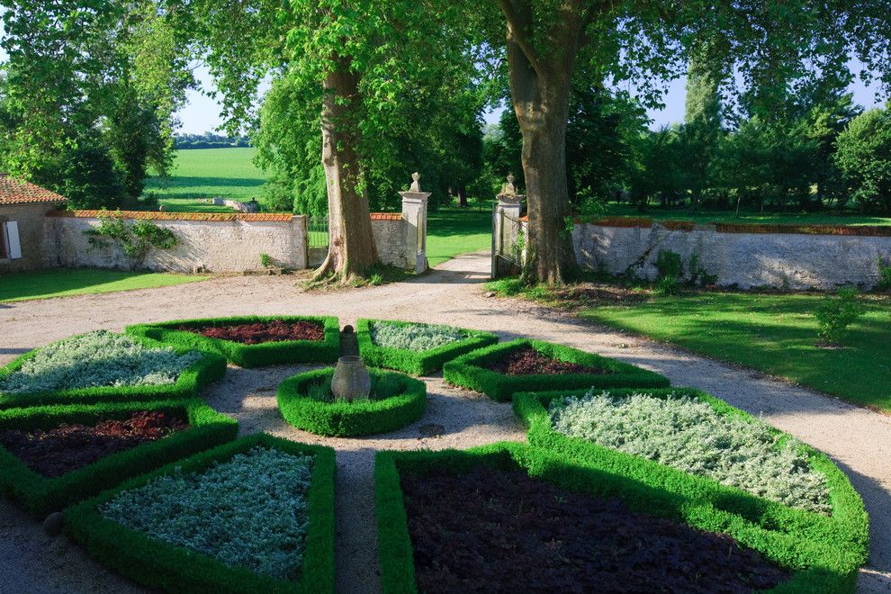 Needham Garden Center for a Traditional Landscape with a Circular Garden and Logis  De Grange, Grange, France by Joel Antunes Photography