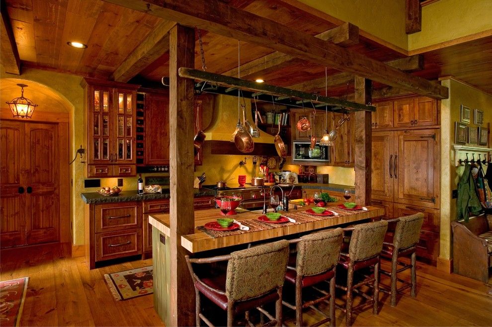 Nora Lighting for a Rustic Kitchen with a Hanging Pot Rack and Kitchen by Lands End Development   Designers & Builders