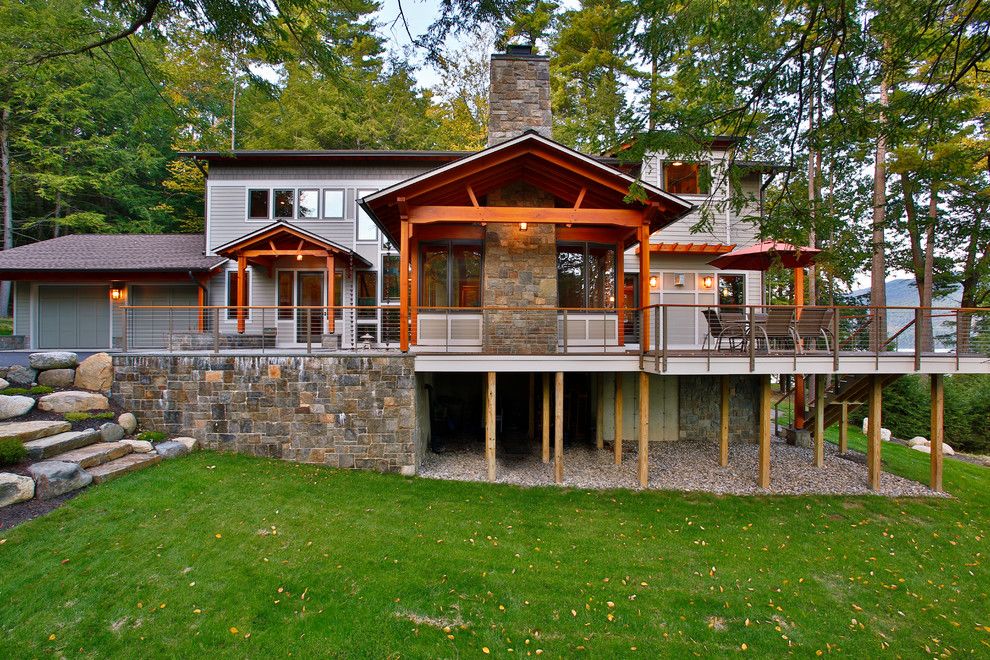 North Country Storage Barns for a Rustic Exterior with a Deck and Bolton Landing Modern Cabin by Teakwood Builders, Inc.