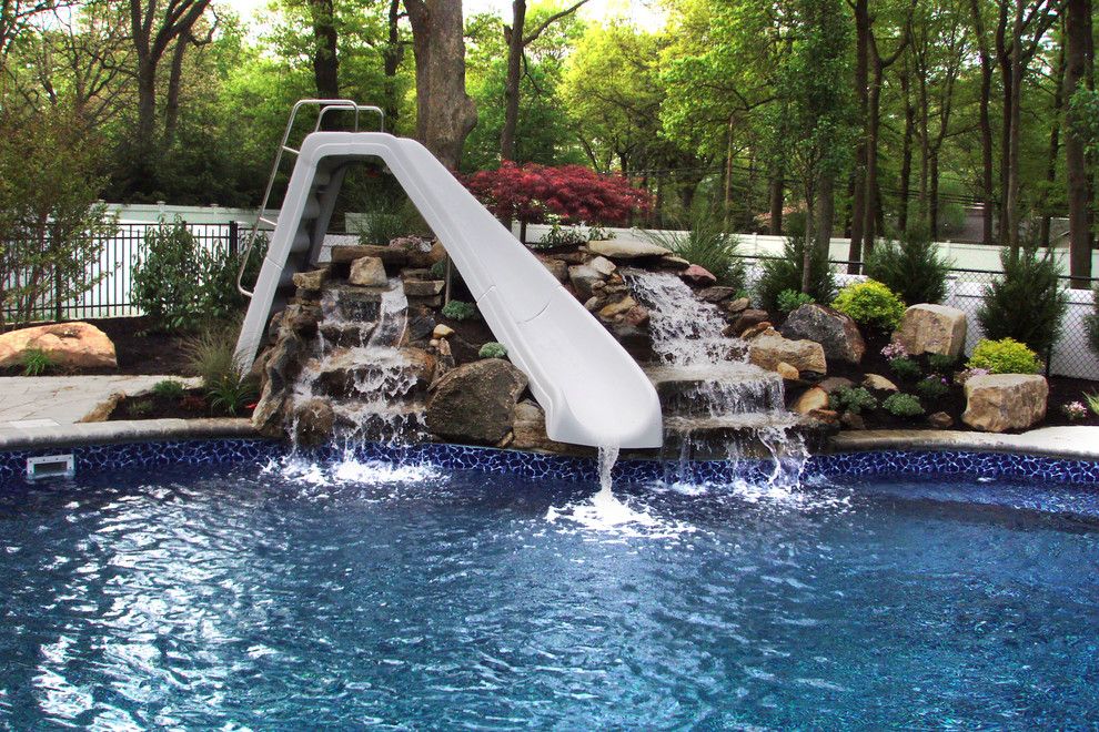 Northport Water for a Contemporary Pool with a Cold Spring Harbor and Natural Pool Design. Unilock Brussels Block. Melville, Ny. by Autumn Leaf Landscape Design
