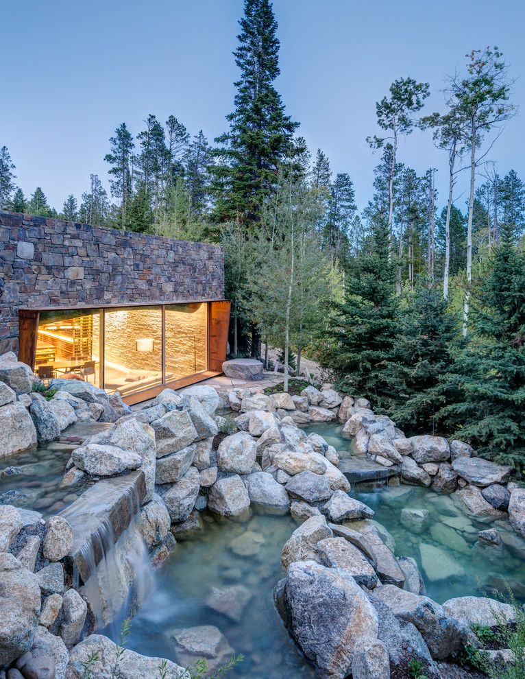 Nwnatural for a Rustic Landscape with a Stone Siding and Slopeside Wine Cellar by Carney Logan Burke Architects