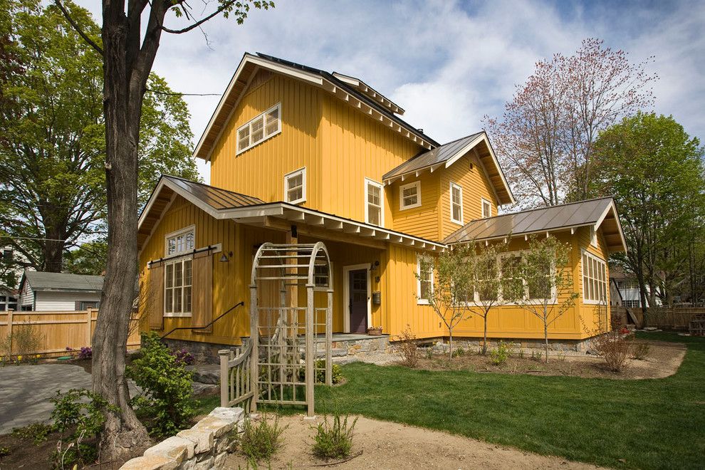 Oasis Ann Arbor for a Farmhouse Exterior with a Yellow Siding and Custom Homes by Phinney Design Group