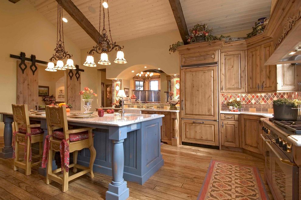 Old Masters Stain for a Rustic Kitchen with a Pendant Light and Keystone Ranch Home by Markel Design Group