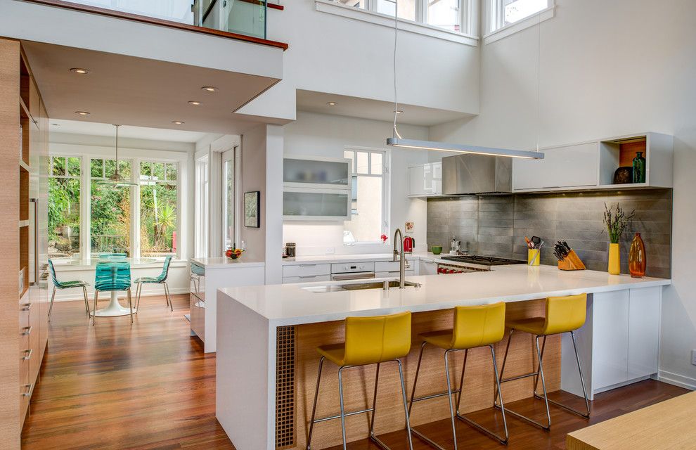 Pacific Energy Wood Stove for a Contemporary Kitchen with a Yellow Bar Stools and Oakland Hills Contemporary by Conscious Construction