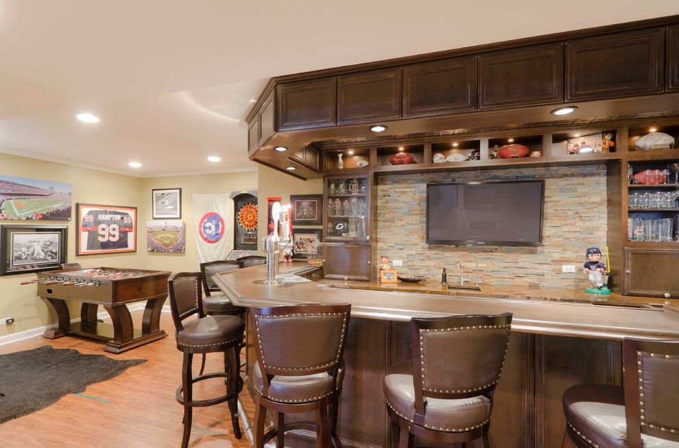 Pasargad for a Contemporary Basement with a Stone and Basement Fit for a Sports Fanatic by Synergy Builders Inc.