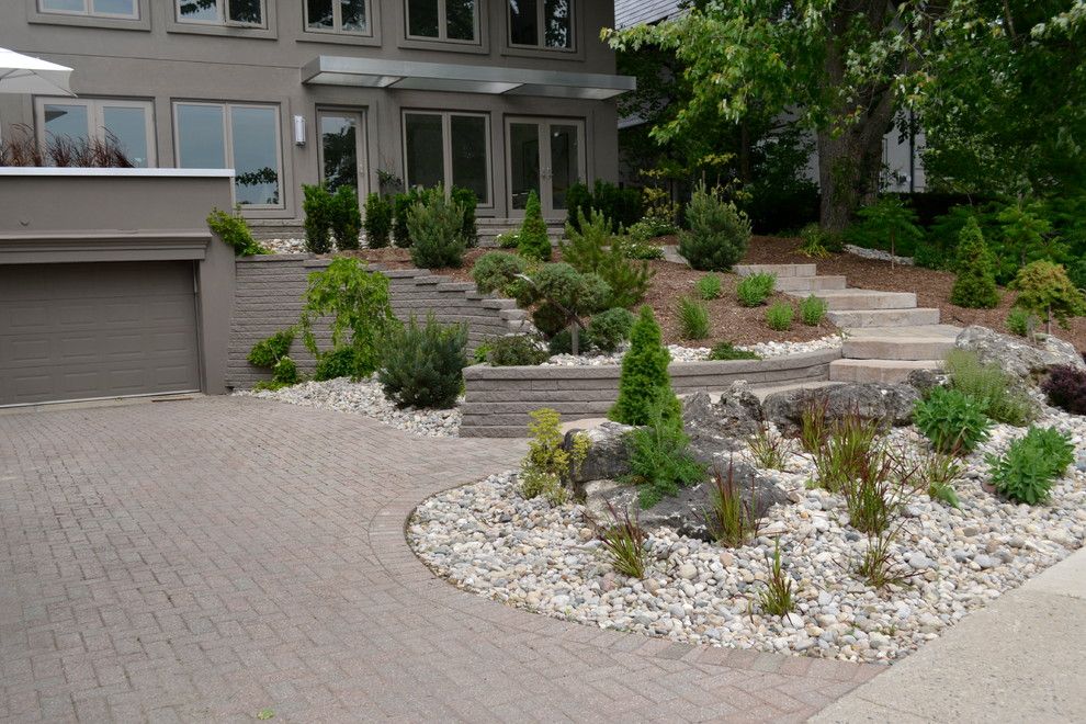 Pavestone for a Rustic Landscape with a Rustic Steps and William Street Front Entrance by Ross Yantzi's Pavestone Plus Ltd.