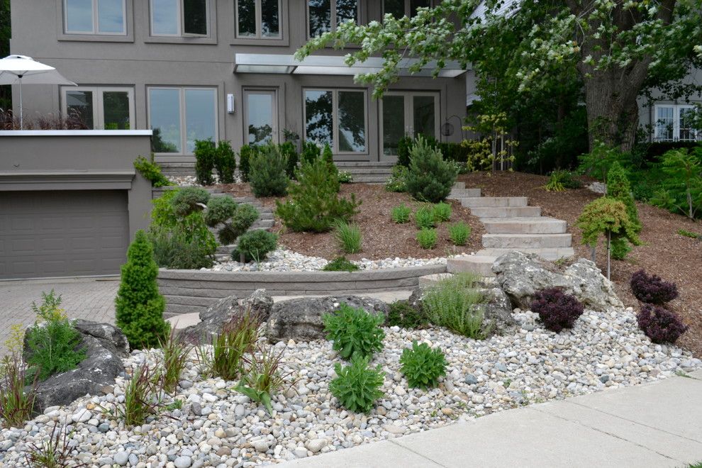 Pavestone for a Rustic Landscape with a Staircase and William Street Front Entrance by Ross Yantzi's Pavestone Plus Ltd.