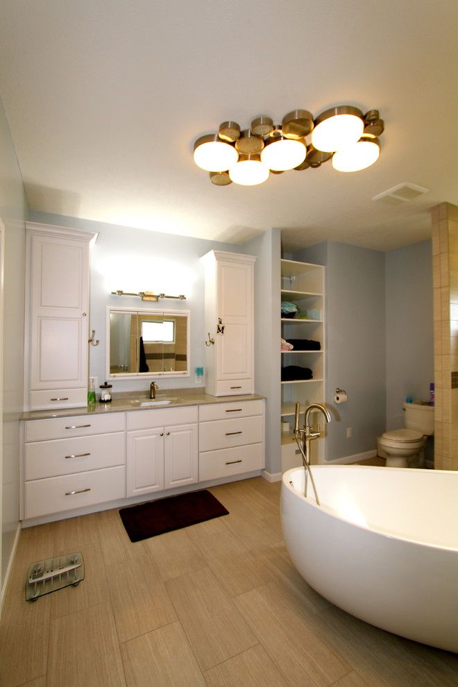 Pearle Vision Omaha for a Modern Bathroom with a Onyx Top and Great Modern Space by Merritt's Quality Cabinets