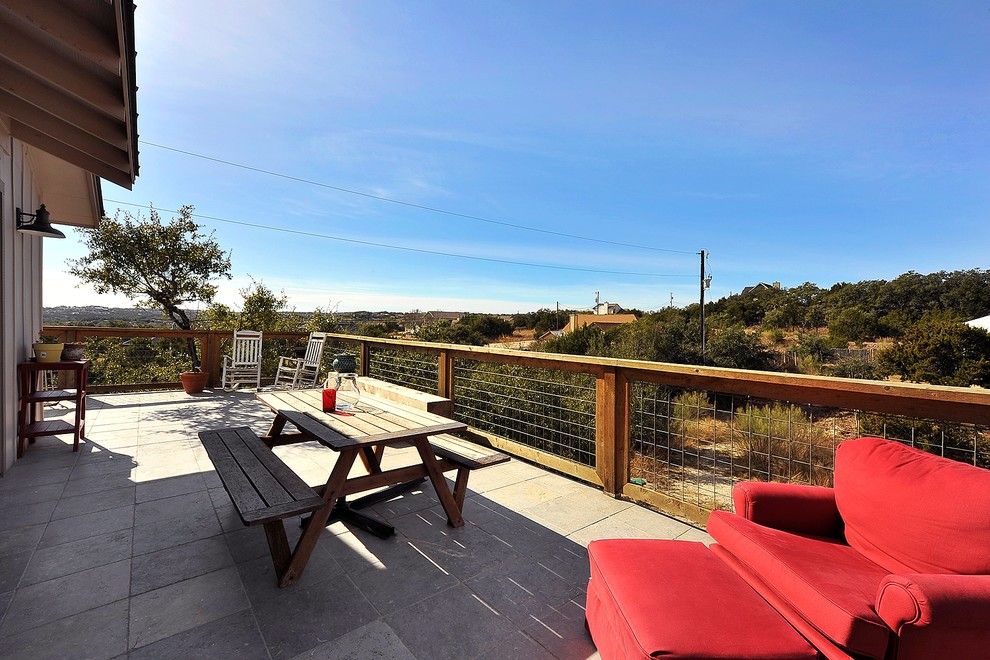 Picket Fence Realty for a Craftsman Deck with a Wire Railing and Hill Country Guest House by Capstone Custom Homes