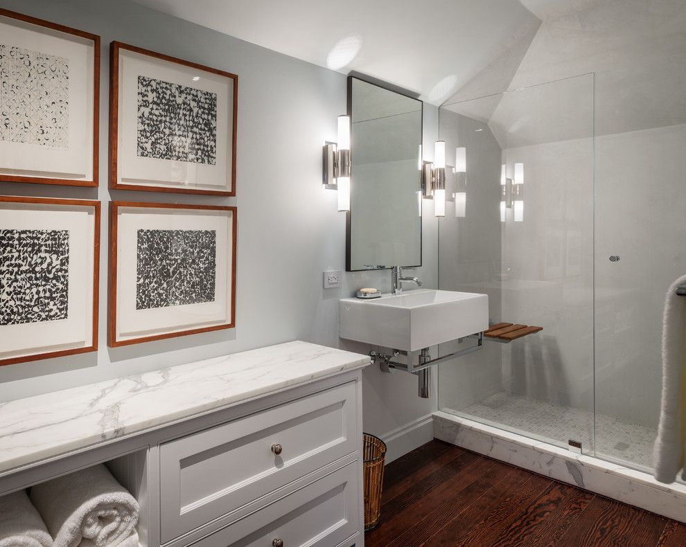 Pierce Flooring for a Transitional Bathroom with a Glass Shower Door and Pierce Street by Sutro Architects