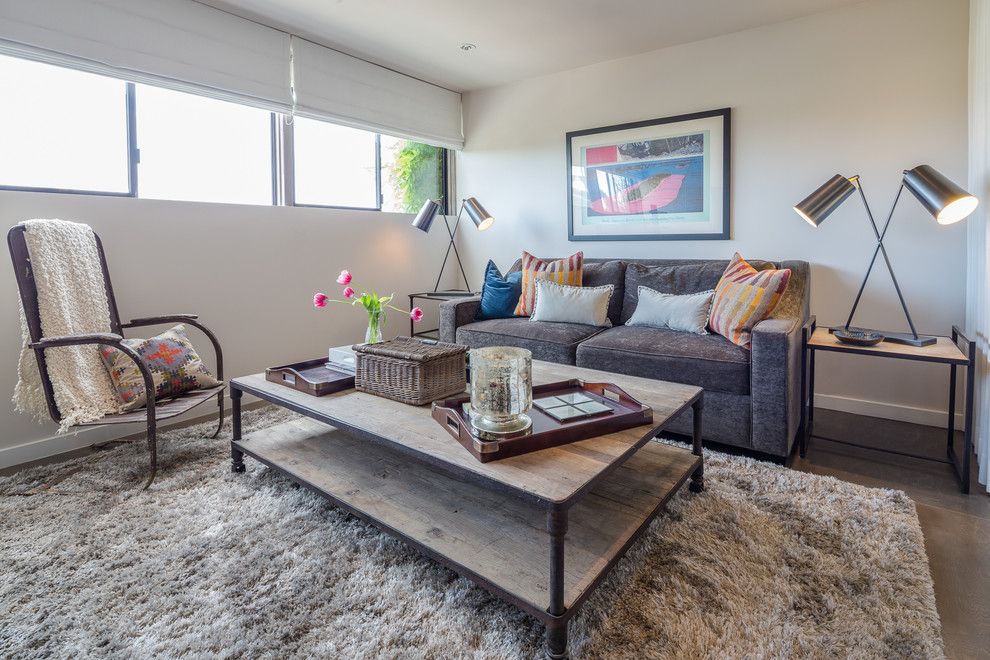 Pilings for a Contemporary Family Room with a Dark Gray Sofa and Venice Beach by Amy Devault Interior Design