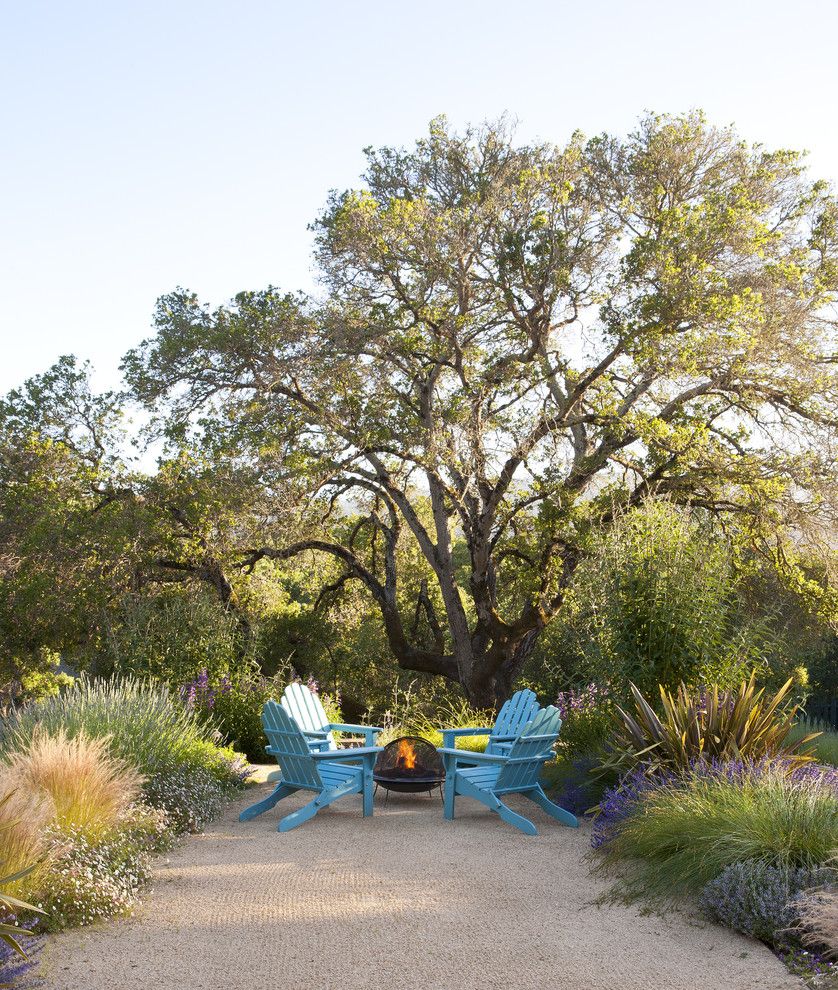 Pine Bluff Sand and Gravel for a Contemporary Patio with a Bright Blue Patio Furniture and Outdoor Fireplace by Arterra Landscape Architects