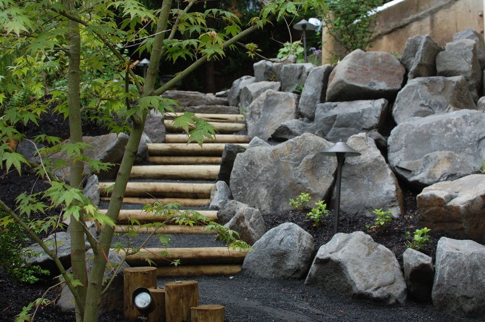 Pine Bluff Sand and Gravel for a Eclectic Landscape with a Boulders and Wood and Stone Steps by Ross Nw Watergardens