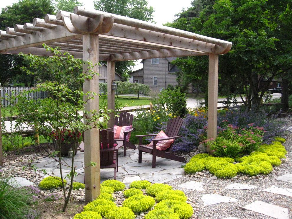Pine Bluff Sand and Gravel for a Traditional Landscape with a Yard and Rustic Pergola by Genus Loci Ecological Landscapes Inc.