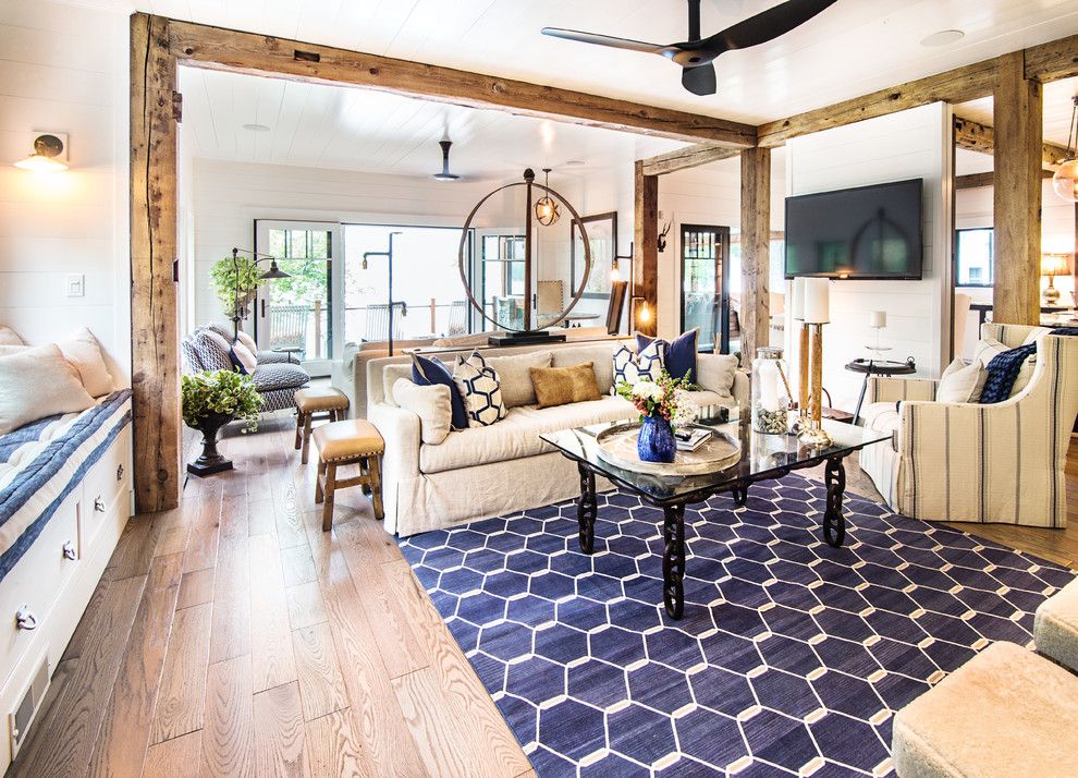 Pismo Dunes for a Rustic Living Room with a Exposed Beams and Lake George Retreat by Phinney Design Group