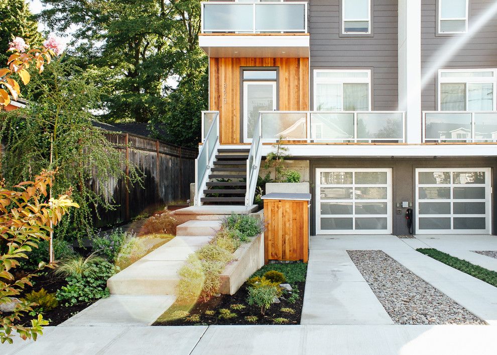 Portland Sand and Gravel for a Modern Landscape with a Wood Exterior and Modern Duplex Front Yard by Pistils Landscape Design + Build