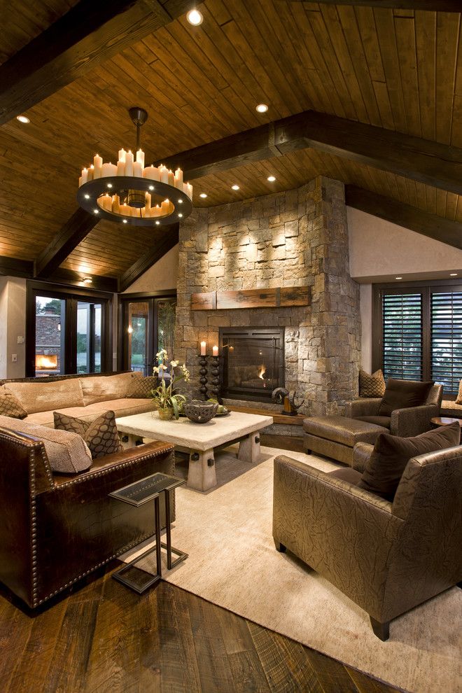 Power Home Remodeling Group Reviews for a Rustic Family Room with a Fireplace Mantel and Rustic Family Room by John Kraemer & Sons