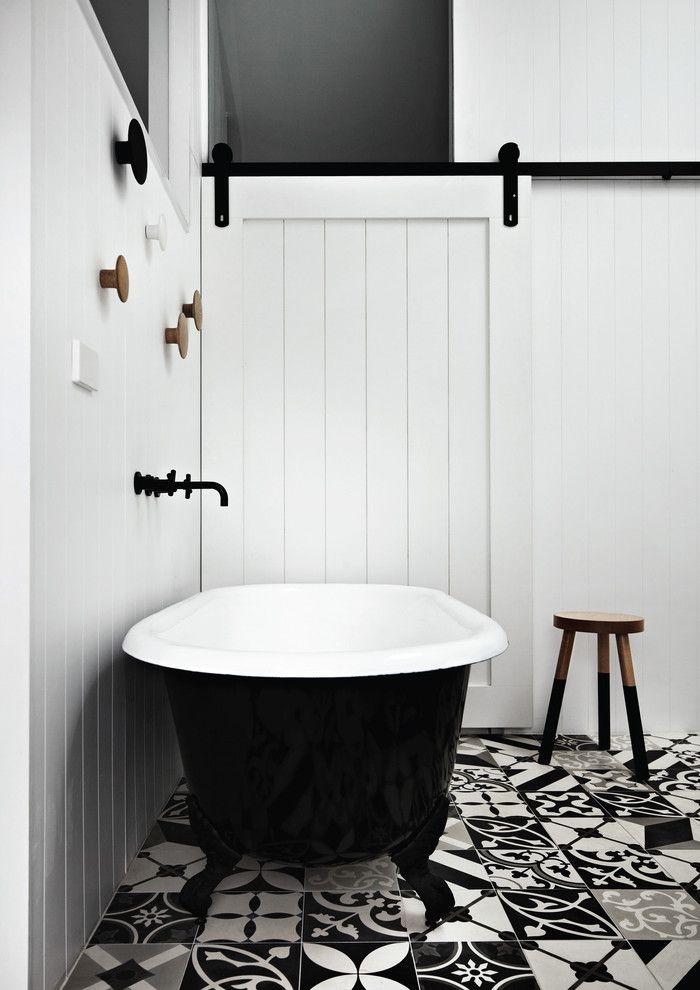 Proper Way to Hang American Flag for a Contemporary Bathroom with a Sliding Barn Door and Kerferd by Whiting Architects