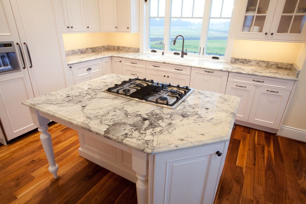 Quartz Countertops vs Granite for a Traditional Kitchen with a Hardwood Floors and Super White Quartzite Kitchen in Calvert County, Md by Granite Grannies