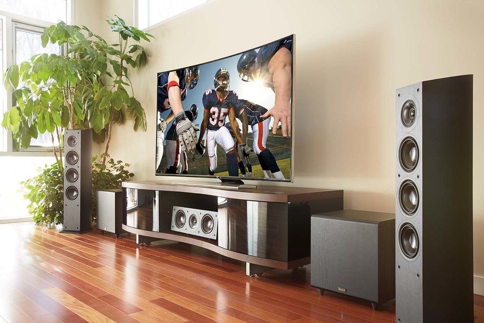 Quincy University Football for a Contemporary Family Room with a Entertainment Center and Family Rooms by Magnolia Design Center