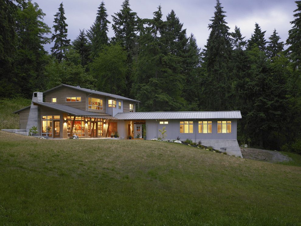 Railroad Tie Retaining Wall for a Contemporary Exterior with a Overhang and Vashon Residence by Goforth Gill Architects