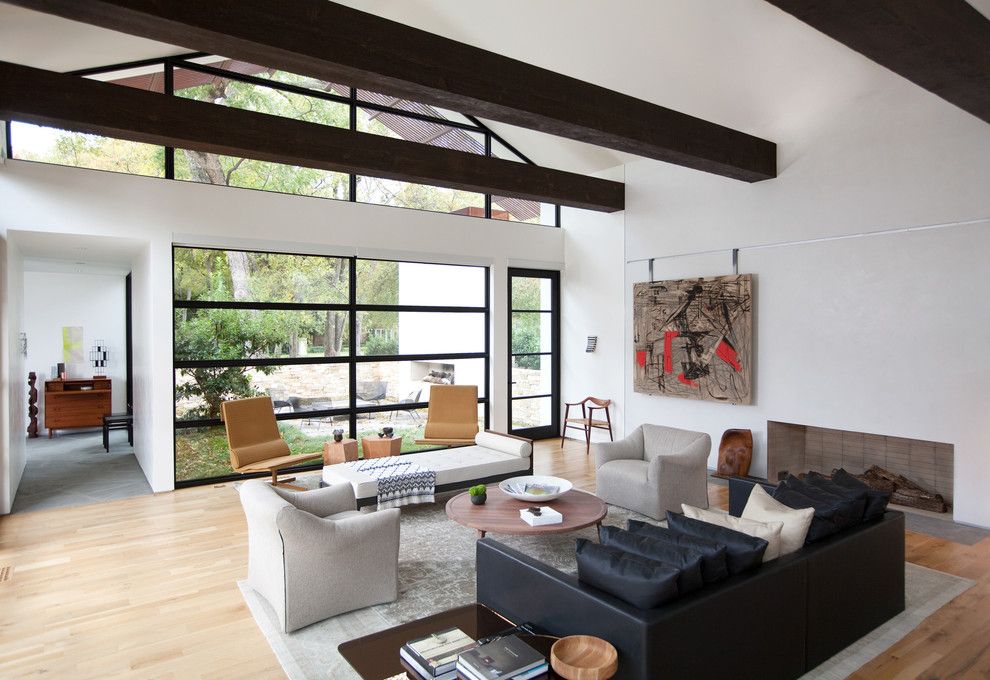 Railroad Tie Retaining Wall for a Contemporary Living Room with a Clerestory Windows and Ranch Home Goes Modern by Western Window Systems