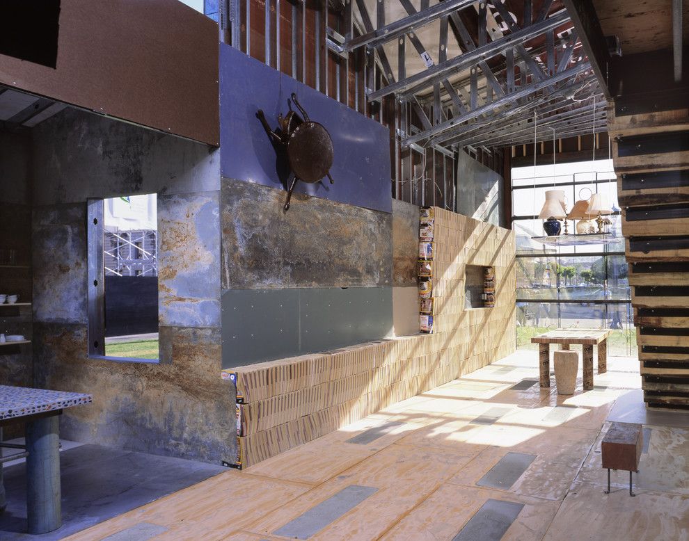 Railroad Tie Retaining Wall for a Rustic Hall with a Glass Wall and Scraphouse by Jensen Architects