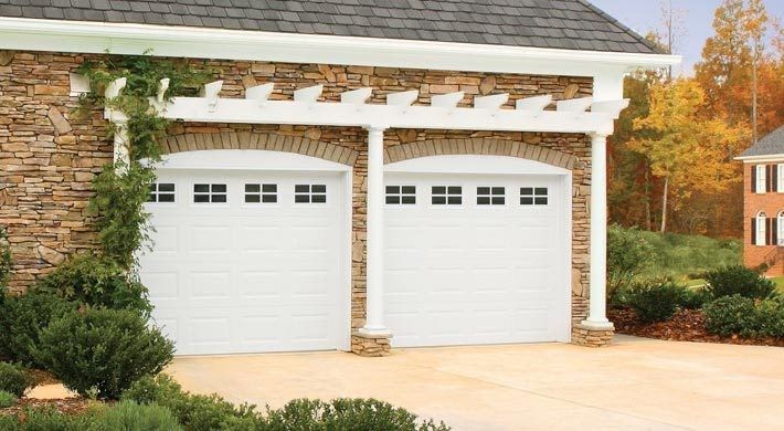 Raspberry Trellis for a Mediterranean Garage with a Exterior and Raised Panel by Empire Overhead Doors, Llc